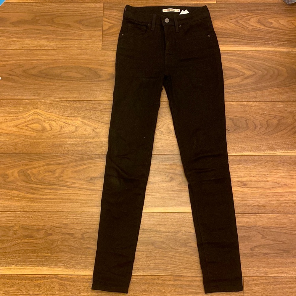 Black skinny jeans, 25 waist, in good shape